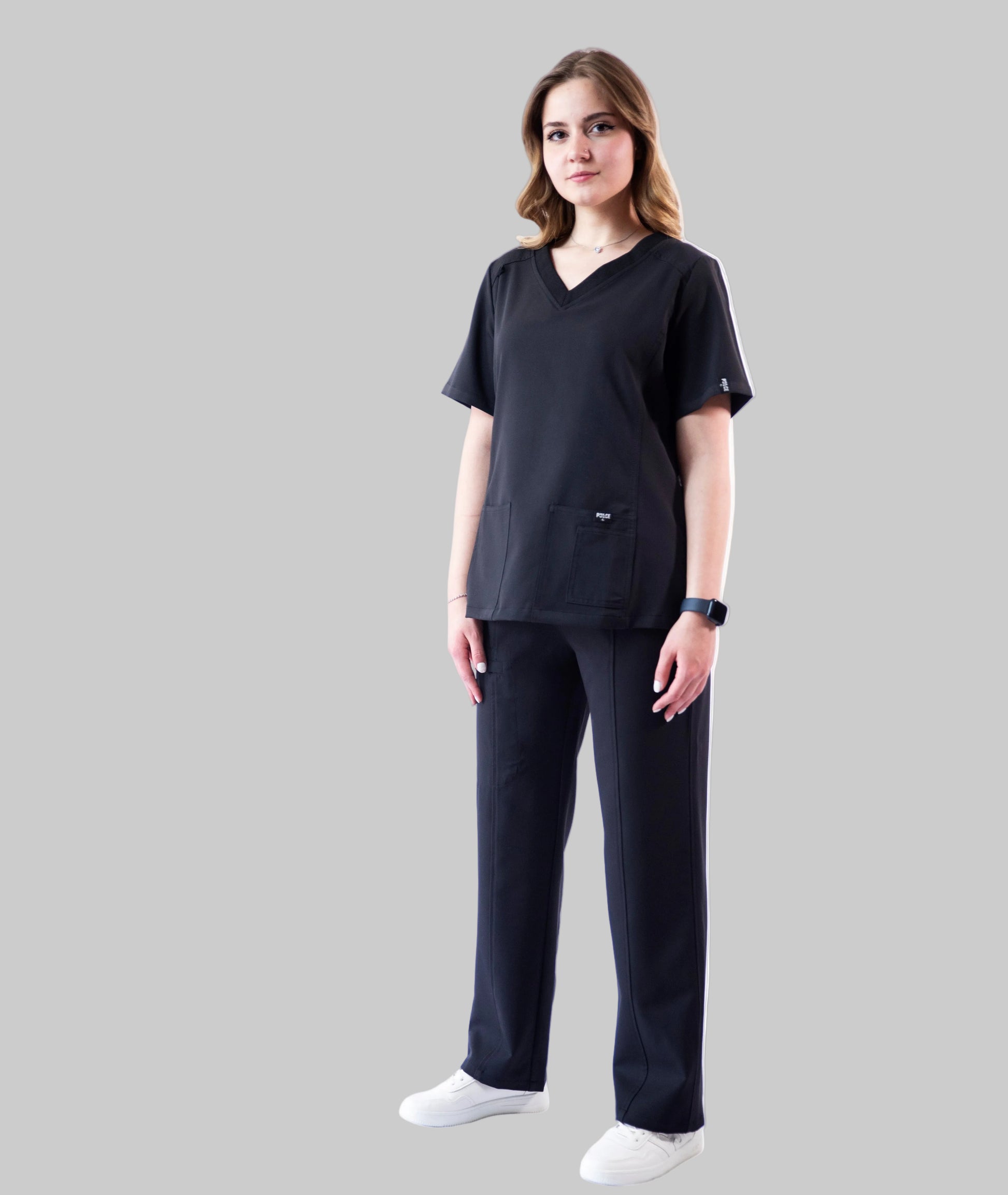 Person wearing a black outfit on a white background