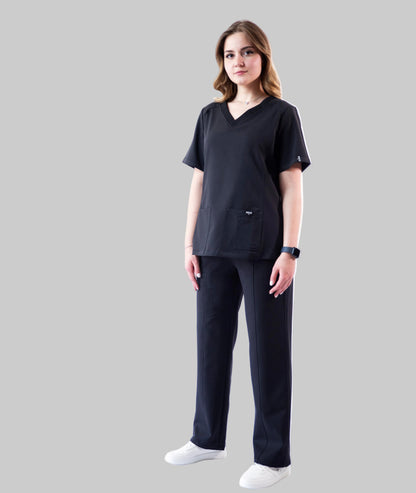 Person wearing a black outfit on a white background