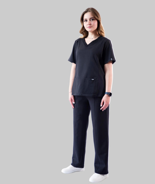 Person wearing a black outfit on a white background