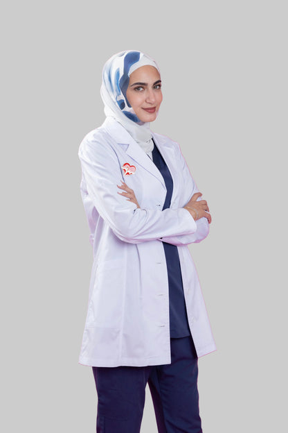 Person wearing a white lab coat and hijab on a pink background