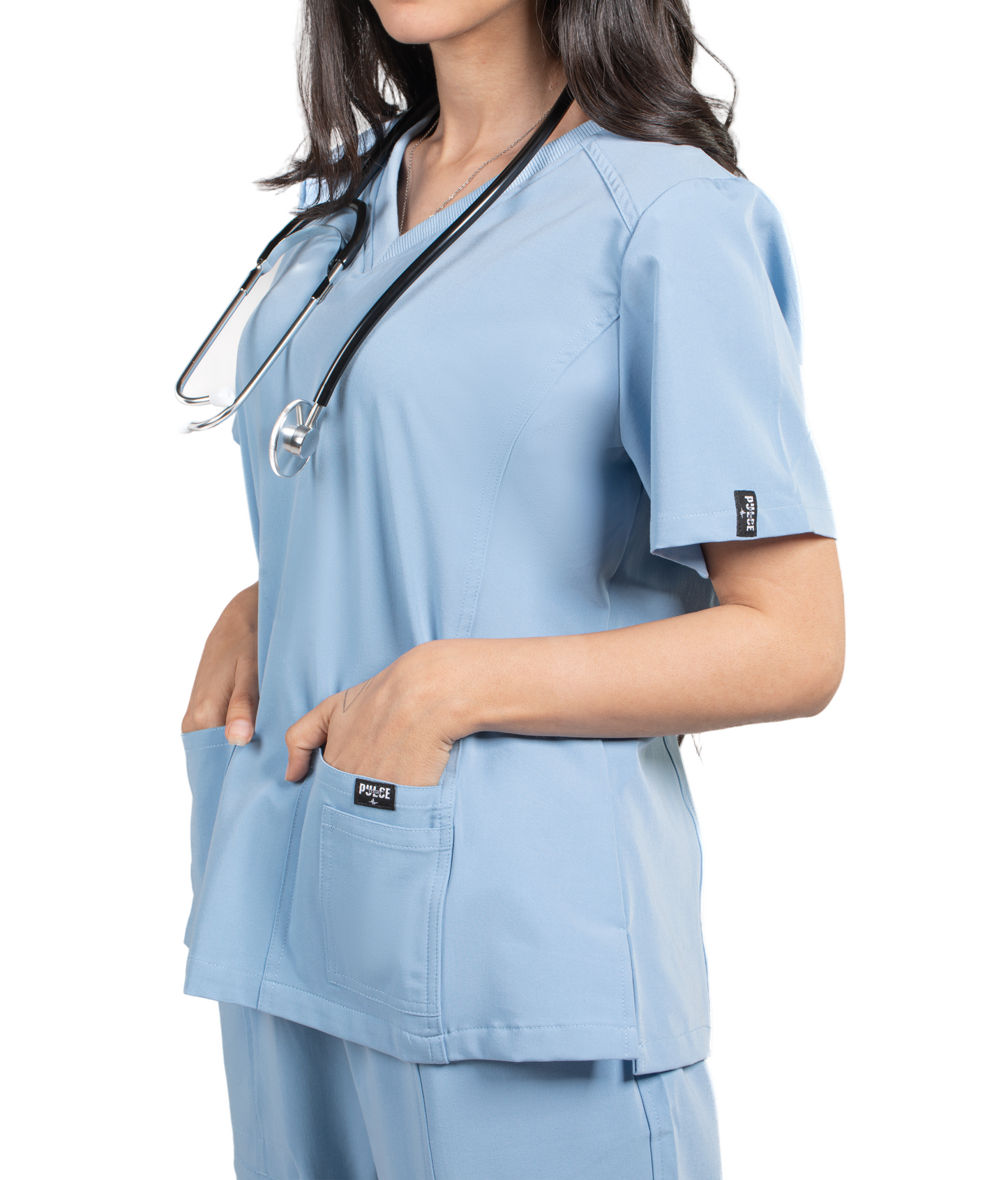 Person wearing light blue medical scrubs with a stethoscope, branded 'Pulse'.